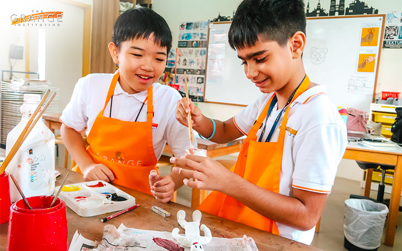 Students in primary school learning art education